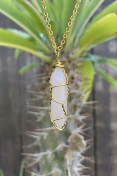 "Beautiful gold wire wrapped rose quartz crystal point pendant on gold plated chain with lobster claw closure. The pendant is approximately 1.25\" long and 0.4\" wide. Please note that all crystals are unique and therefore color, shape and size may vary slightly. Please choose a necklace length from the drop-down menu. In case you would like a length other than the listed options, leave us a note at checkout. Item will be shipped 1 - 2 business days after purchase. \"The fair and lovely Rose Qua Gold Bohemian Rose Quartz Necklace, Handmade Gold Crystal Necklace With Rose Quartz, Gold Rose Quartz Wire Wrapped Necklace, Gold Wire Wrapped Rose Quartz Necklace, Gold Wire Wrapped Rose Quartz Jewelry, Gold Wire-wrapped Rose Quartz Necklace, Gold Wire Wrapped Crystal Pendant Necklace, Gold Wire-wrapped Pendant Crystal Necklaces, Gold Wire-wrapped Crystal Pendant Necklace