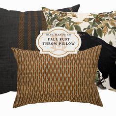 three pillows with different designs and words on them, one is black and the other is brown