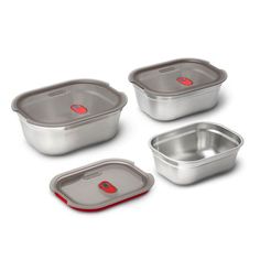 four stainless steel food containers with lids and red trimmings on the bottom, one is