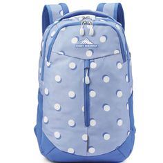 a blue backpack with white polka dots on it