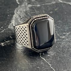 Mens Black Onyx Stone Ring , Natural Black Onyx Gemstone Ring , Square Black Ring , Signet Ring , Hand Engraved Silver Ring , Gift For Him , Same Day For Shipping ✧ Product Details * Handmade İtem * Gender : Male / Female * Material : 925K Sterling Silver * Ring Weight : 8.5 Grams * Gemstone Type : Black Onyx ✔ Usage Details * Silver jewelry is very sensitive to chemicals. It is recommended to keep away from chemical substances such as cream, bleach, deodorant, detergent. * Silver jewelry can also darken quickly in salt water, that is, in sea water. For this reason, it is best to remove them when swimming in the sea. ✔ Shipping * Your orders placed on weekdays are delivered to the cargo on the same day. Your orders placed on the weekend are delivered to the cargo on Monday. ✔ Other Details Black Metal Rings For Gifts, Black Metal Rings For Gift, Black Gothic Gemstone Jewelry, Black Open Ring Metal Rings, Black Onyx Signet Ring For Gift, Black Metal Open Ring, Elegant Black Metal Rings, Gothic Black Formal Ring, Adjustable Black Signet Ring With Polished Finish