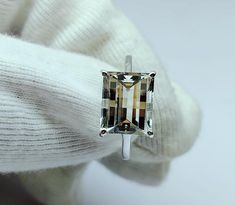 Netural crystal gemstone, pixel cut,rectangle Shape,engagement ring, anniversary gift, fantasy cut stone ring, Stone - neutral crystal gemstone  Ring Weight - 3 to 4.5 gram  Stone size - 9×11  mm Luster - Transparent  Ring size - 7 US to all US size  Material - 925 sterling silver  Code -  Az288 Gift Topaz Ring With Prong Setting And Rectangular Stone, Rectangular Topaz Ring With Prong Setting For Promise, Gift Rectangular Topaz Ring With Prong Setting, Silver Topaz Ring With Rectangular Stone For Wedding, Radiant Cut Crystal Ring With Prong Setting For Gift, Rectangular White Gold Topaz Ring For Gift, Classic Rectangular White Gold Topaz Ring, Modern Rectangular Topaz Wedding Ring, Gift Square Cut Topaz Ring With Prong Setting