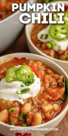 two bowls of pumpkin chili with sour cream and jalapenos