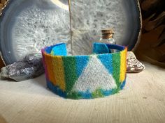 Handmade cuff, made from Pendleton® Wool and metal cuff. Able to get larger or smaller with simple bend to the cuff. Multicolor Cuff Bracelet As Gift, Modern Adjustable Multicolor Cuff Bracelet, Adjustable Multicolor Cuff Bracelet, Multicolor Handmade Cuff Bracelet Collectible, Vintage Hand-tooled Cuff Bracelet For Festivals, Multicolor Handmade Cuff Bracelet - Wearable Art, Southwestern Adjustable Multi-stone Cuff Bracelet, Southwestern Blue Nickel-free Cuff Bracelet, Pendleton Wool