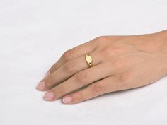 This gold oval ring can be a Pinky ring or a wedding band. The expanding structure adjusts to fit your body, making it especially comfortable. ✦ Material ✦ 18k yellow solid gold ✦ Details ✦ Signet width: 7.2 mm, length: 9.5 mm Finish: matte in the front with a shiny band - Please note All of our items are meticulously made in our studio in HaYogev. Manufacturing time takes 10-20 days. Ring Size This price is for a ring up to size 9. If you need a bigger size please contact us for the price and d Gold Oval Ring, Pinkie Ring, Gold Pinky Ring, Signet Rings Women, Stone Ornaments, 18k Gold Bracelet, Midi Ring, Gold Signet Ring, Rose Gold Band