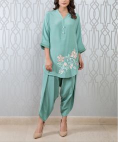 Stylish semi formal party wear Pakistani short tunic with dhoti salwar This super trendy pistachio green short tunic has beautiful floral resham thread embroidery. It has matching dhoti salwar to complete the look. ✨We stitched outfit with lot of care, so that our customers should not have any issues regarding finishing and fitting. 🌸All the dress are hand wash and do not use any harsh detergent. To make your outfit long lasting use fabric conditioner after wash. Pista Green Resham Embroidered Kurta For Spring, Pista Green Kurta With Resham Embroidery For Spring, Spring Pista Green Kurta With Resham Embroidery, Spring Tunic Sets With Resham Embroidery, Spring Sets With Resham Embroidery Tunic, Semi-stitched Pista Green Palazzo Set For Spring, Anarkali Tunic With Resham Embroidery For Summer, Summer Anarkali Tunic With Resham Embroidery, Summer Pista Green Kurta With Floral Embroidery