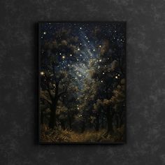 the night sky with stars and trees in it, framed on a wall above a chair