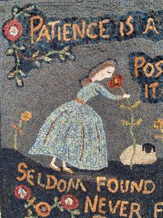 a tapestry with an image of a woman in blue dress and flowers on the ground