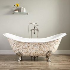 an old fashioned claw foot bathtub in a bathroom