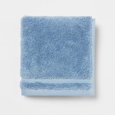 a light blue towel on a white background