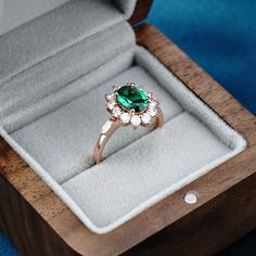 Introducing the 'Emerald Sunburst Ring'—a meticulously handcrafted solid gold engagement ring. This unique masterpiece showcases an oval-cut emerald at its core, encircled by dazzling Moissanite accents, creating a radiant sunburst effect. A symbol of timeless elegance and new beginnings ITEM DESCRIPTION Handmade with meticulous craftsmanship.Metal Options: Solid 14K, and 18K Gold.Gold Colors Available: Rose gold, Yellow gold, White gold. Style: Halo Ring / Flora Ring 💍 ENGAGEMENT RING 💍 Cente Oval Emerald Birthstone Ring In Fine Jewelry Style, Heirloom Oval Emerald Ring, Oval Emerald Ring In 14k Gold For Proposal, Oval Emerald Ring With Halo Design, Oval Moissanite Ring For May Birthstone, Heirloom Style Emerald Ring With Halo, Heirloom Emerald Ring With Halo, Oval Emerald Ring For Gift, Oval Emerald Ring As A Gift