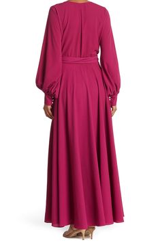 A dramatic wrap maxi dress adds eye-catching style that's perfect for any occasion. 62" length (size Small) Surplice V-neck Long sleeves Attached waist tie Partially lined 100% polyester Hand wash, dry flat Made in the USA Purple V-neck Maxi Dress For Fall, Modest V-neck Maxi Dress For Party, Purple Long Maxi Dress For Fall, Purple Maxi Dress For Fall, Flowy Long Sleeve Wrap Dress, Pink Floor-length Maxi Dress For Fall, Purple Flowy Long Sleeve Maxi Dress, Classic Slippers, Kids Rain Boots