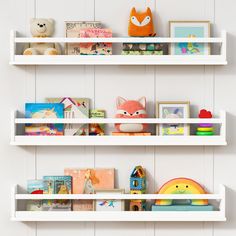 two white shelves filled with books and toys