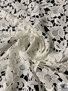 an image of white lace on black background