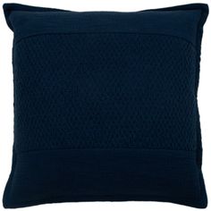 a dark blue pillow on a white background