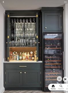 a bar with wine glasses and liquor bottles in front of an open doored cabinet