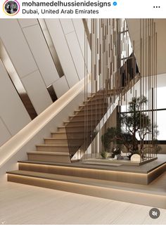 an image of a stair case in the middle of a room with stairs and plants