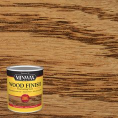 a can of wood finish paint on top of a wooden table with the words minwax