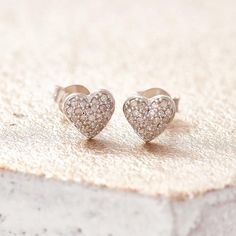 Diamond heart earrings, tiny diamond studs, real diamond heart studs simple diamond studs, bridesmaid studs, genuine diamond silver earrings_________________________________________________Tiny diamond heart shaped studs cast in silver and set with genuine diamonds by British jewellery designer Claudette Worters.  These real diamond heart earrings are a perfect gift for your wife, make great wedding earrings and make very pretty sparkling bridesmaid studs.Matching diamond necklace available here Diamond Heart Earrings, Diamond Monogram, Real Diamond Necklace, Valentines Bracelets, Red Pendants, Simple Diamonds, Tiny Diamond, Heart Shaped Diamond, Valentines Necklace