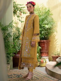 Luxury Embroidered Pakistani Salwar Kameez Mustard Salwar Suit is a breathtaking attire that will give you a chic look on the big day. Floral designs and shimmering sequins give a glamorous touch to this perfectly stitched Pakistani Party Dress. Embroidered Kameez: The kameez in chiffon fabric is emblazoned with lavish floral designs and embroidery. Beaming sequins and threads make this beautiful chiffon kameez in an alluring orange shade a perfect choice to wear to the occasion. Hanging motifs Organza Shirt, Velvet Dress Designs, Pakistani Salwar, Pakistani Dresses Casual, Salwar Kamiz, Pakistani Salwar Kameez, Simple Pakistani Dresses, Embroidery Suits Design, Designer Party Wear Dresses