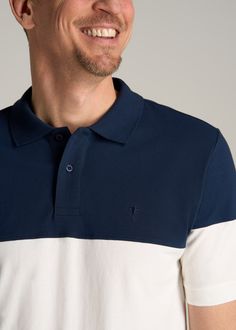 About Our Classic Color-Block Tall Men's Polo Shirt Update your tall men’s polo shirt collection with our new, color-block polo. Designed with classic polo features like a button placket, crisp collar and clean fit, this versatile shirt is ready for everything from casual Fridays to clubhouse Sundays. We’ve created this extra long polo shirt intentionally for men from 6’ to 7’1, so it has longer sleeves and an extended body tailored specifically for your frame. It’s built with stretch-infused co White Color Block Polo Shirt, Collared Cotton Tops With Contrast Color, Cotton Collared Tops With Contrast Color, Casual Polo Collar Top With Contrast Color, Casual Color Block Cotton Polo Shirt, Casual Tops With Polo Collar And Contrast Color, White Color Block Cotton Polo Shirt, Navy Color Block Collared Top, White Color Block Short Sleeve Polo Shirt