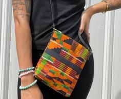 "This beautiful Kente Mini-Crossbody Bag is perfect for all your outings. It features: -42\" leather strap. Dimensions  7\"x 8\"" Adjustable Crossbody Bags For On-the-go, Multicolor Crossbody Shoulder Bag For On-the-go, Bags With Adjustable Handle For On-the-go, Casual Crossbody Box Bag For On-the-go, Summer Crossbody Shoulder Bag With Cell Phone Pocket, Casual Long Strap Crossbody Bag Strap, Summer Crossbody Box Bag With Adjustable Strap, Daily Use Crossbody Box Bag With Adjustable Strap, Daily Crossbody Box Bag With Adjustable Strap