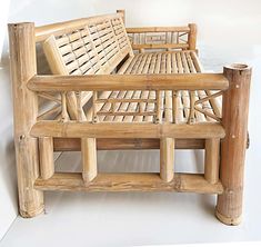 a wooden bench made out of bamboo sticks