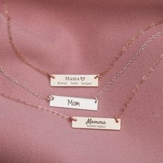 "A Personalized Mama Necklace for the woman who always gives and loves unconditionally. Our Personalized Mama Bar Necklace is the perfect way to show any special mother how much you care! This dainty necklace can be personalized with any mom name, in addition to a special quote or message, date, kids names, and more, making it a truly unique and special gift. Create a one-of-a-kind piece she'll love. A thoughtful and precious keepsake that's sure to become part of Mama's everyday jewelry collection, Give her something truly special that allows her to cherish her babies wherever she goes! Designed with warmth and personal touches in mind - just like the relationship between Mom and her kiddos! Let Mom know how much you care in a unique way that stands out. Melanie Golden Jewelry's Engraved Mother's Day Gift Rectangular Pendant Necklace For Mom, Mother's Day Engraved Rose Gold Charm Necklace, Hand Stamped Charm Necklace For Mom, Personalized Rose Gold Bar Necklace For Gift, Personalized Rose Gold Bar Necklace As Gift, Personalized Bar Necklace For Mother's Day, Personalized Bar Necklace As Gift, Gift Rectangular Pendant Bar Necklace, Personalized Rectangular Pendant Necklace For Mother's Day