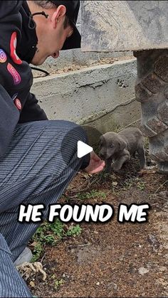 a man kneeling down next to a baby elephant and touching it's paw with the caption he found me