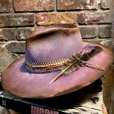 Little Wing Is A Brand New Olive & Pique Hat That I’ve Reshaped, Dyed, Burned, Sanded And Distressed Using Paint And Fire. The Side Has Been Heat Etched With A Hummingbird And Morning Glory Design, Adding Even More Interest To This Beautiful Periwinkle Blue Ranch Hat. The Band Is Genuine Cobra Skin, Overlaid With Bandana, Leather Cord, And Twine. Two Feathers Adorn The Left Side. Size Is Adjustable With A Hidden Velcro Tab Underneath The Sweatband. Crown 4.5” Brim 3.5” #Spell #Magnoliapearl Ranch Hat, Morning Glory Design, Two Feathers, Festival Hat, Magnolia Pearl, Cowgirl Hats, Periwinkle Blue, Morning Glory, Morning Light