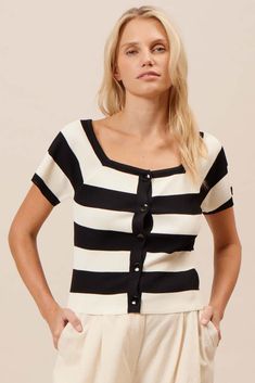 DESCRIPTION Upgrade your wardrobe with our Skipper Striped Top in Black Cream. This chic and trendy top is perfect for any occasion, offering a blend of style and comfort. With its eye-catching stripes and flattering fit, you'll love how it elevates your look effortlessly. Whether you're heading to a casual outing or a day at work, this top is your go-to choice for a polished appearance. Key Features: Stylish Design: Bold black and cream stripes for a modern look Flattering fit that complements Everyday Pants, Trendy Top, Bold Stripes, Sweater Tank Top, Comfortable Tops, Black And Cream, Bold Black, New Tops, Dress Trousers