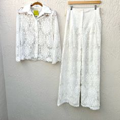 Brand Carol Bassi Made In Brazil Model Matching Lace Set Button Down Shirt And Long Wide Leg Pants Great For Beach Wedding, Bachelorette, White Party Pants Are Lined And Ultra High Waisted. Zipper In Front Material See Label Color Off White Condition Worn 1-2 X Excellent Condition No Flaws Size Both Pieces 38 - Medium Retails For $5.000 Reais - $1.000 Usd Measurements Shirt Pit To Pit 18.5” Shoulder To Shoulder 15” Length 25” Sleeve Length 24” Pants Waist 14.5” Front Rise 16” Inseam Length 34” 5 White Button-up Summer Pants, Spring Daywear Sets With Button Closure, White Long Sleeve Sets With Button Closure, Elegant Cotton Sets With Buttons For Spring Daywear, White Button-up Pants For Work, Fitted Button-up Bottoms For Daywear, White Button-up Sets For Spring, White Pant Set For Spring Workwear, Brazil Model