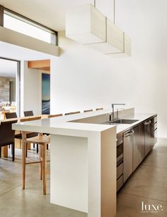 the kitchen is clean and ready to be used as a dining room or office space