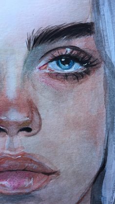 a drawing of a woman's face with blue eyes