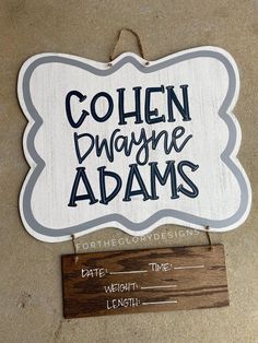 a wooden sign that says, gohen dwayne adams