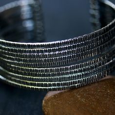 "Engraving oxidized sterling silver stack cuff bracelet(FBA) Bracelet measure: 6\" L (end to end) X 1.3\" W Weight:49.36 g All items are hand crafted by me, Sirilak Samanasak in Chiang Mai, Thailand. Each piece is one of a kind and the item pictured is the exact item that will ship. Every gemstone is hand selected for its quality and beauty and are hand set into settings and final jewelry pieces. JEWELRY CARE Most jewelry in my shop is sterling silver which can easily be cleaned and re polished Modern Adjustable Oxidized Jewelry, Modern Oxidized Cuff Bracelet Bangle, Modern Oxidized Finish Cuff Bracelet Bangle, Modern Oxidized Finish Cuff Bangle Bracelet, Modern Cuff Bracelet With Oxidized Finish, Unique Oxidized Metal Cuff Bracelet, Unique Metal Cuff Bracelet With Oxidized Finish, Adjustable Metal Cuff Bracelet With Oxidized Finish, Modern Silver Cuff Bracelet With Oxidized Finish