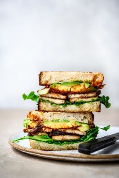 two sandwiches stacked on top of each other with the words vegan blt above them