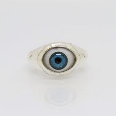 Sterling Silver Evil Eye Blue Dome Ring ...Marked 925...Total of weights 3.9grams...Size 6...Measure of Face 11.3MM...It's in very good condition. Blue Classic Sterling Silver Signet Ring, Classic Blue Sterling Silver Signet Ring, Blue Sterling Silver Open Ring, Blue Sterling Silver Rings With Polished Finish, Blue Sterling Silver Ring With Polished Finish, Classic Blue Turquoise Ring In Sterling Silver, Classic Blue Turquoise Sterling Silver Ring, Handmade Blue Sterling Silver Signet Ring, Blue Sterling Silver Hallmarked Signet Ring