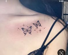 the back of a woman's shoulder with three butterflies on her left side chest