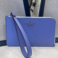 Kate Spade Lucy Small L-Zip Wristlet Evening Blue Iris Multi Nwt Authentic Style Number Kh769 Measurements Length: 6.1023" Height: 3.8" Width: 6.1" Materials Saffiano Leather Two Way Script Logo Lining Features Zip Closure Metal Pinmount With Spade Logo Dust Bag Included: No Made In Imported Ksny - Kate Spade New York Editor's Notes It’s True, This Petite Accessory Has The Perfect Space For Money And Cards. But Feel Free To Throw In Your Lipstick And Chocolate Stash As Well. Blue Wristlet With Zipper Pouch For Travel, Blue Wristlet With Zipper Pouch For Daily Use, Blue Wristlet For Travel, Cheap Blue Women's Wristlet, Elegant Blue Kate Spade Bag, Blue Zipper Pouch Wristlet, Luxury Blue Kate Spade Bags, Blue Pouch Wallet With Zipper Closure, Kate Spade Blue Travel Wallet