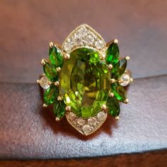 AMAZING AMAZING AMAZING Peridots are fairly common gemstones, HOWEVER, NOT in solitaires of this size. The featured Peridot is a 14x10 oval that weighs in at 5.5 Carats! The loose stone all by itself is approximately $500! It is then surrounded by 8 marquise Chrome Diopside stones, and filled in with Diamond-Cut White Zircons. Set in 14K Yellow Gold, the ring weighs 5 grams. Hallmarked 14K UTC China Size 7.25, ring can be sized Note: Peridot is the Birthstone for August💚 Contact me with any que Zircon Ring, Multi Stone Ring, Multi Stone, Diamond Cut, Very Rare, Stone Rings, Birthstone, Diamond Cuts, Jewelry Rings