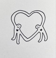 two people holding hands in the shape of a heart on white paper with black ink