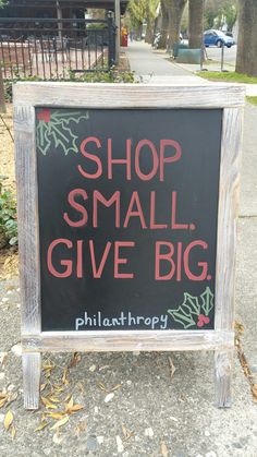 a sign that says shop small give big