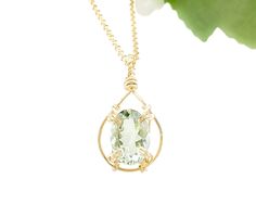 A beautiful, clear oval green amethyst is wire-wrapped to a handcrafted teardrop-shaped pendant frame. So classy and elegant! MATERIAL Gold filled chain Gold filled wire Genuine oval-shaped green amethyst gemstone SIZE 14x10mm gemstone 17.5 inch chain CLOSURE Lobster clasp WHAT IS GOLD FILLED? We used to have just 2 choices: pure gold or gold plate. The first was very expensive and the second was...well...not very good. Our gold filled jewelry is designed to last you a lifetime without the price Oval Green Amethyst Jewelry, Green Amethyst Pendant Necklace As Gift, Oval Green Amethyst Gold Jewelry, Elegant Oval Wire Wrapped Necklace, Green Amethyst Oval Jewelry, Green Oval Amethyst Jewelry, Oval Green Amethyst Jewelry With Gemstone Accents, Green Amethyst Jewelry For May Birthstone Gift, Elegant Round Wire-wrapped Crystal Necklaces