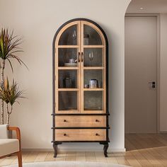 a wooden cabinet with glass doors in a living room