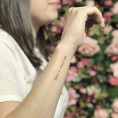 a woman with a small tattoo on her arm