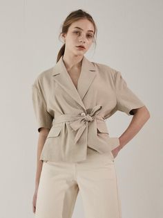 This linen jacket is a versatile piece that can elevate any outfit effortlessly. It features puffed details at the shoulders and sleeves, exuding modern mood.- Semi-cropped length that makes your look stylish- Can be worn buttoned up with eco-friendly buttons or cinched at the waist with the included belt- Offers great stretchability and wrinkle recovery for easy care Chic Linen Button-up Outerwear, Modern Linen Blazer For Spring, Modern Linen Outerwear For Summer, Modern Linen Summer Outerwear, Chic Short Sleeve Blazer For Business Casual, Chic Cropped Jacket For Summer Workwear, Chic Short Sleeve Business Casual Blazer, Beige Outerwear For Office Wear In Spring, Beige Spring Outerwear For Office