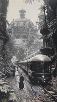 a black and white photo of a train on the tracks