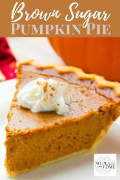 a slice of brown sugar pumpkin pie on a white plate with whipped cream in the middle