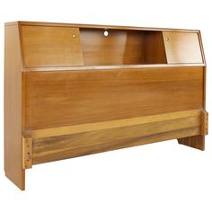 a wooden bed frame with an open drawer on the top and bottom section, made out of wood